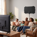 Indoor satellite HDTV antenna mounted behind a TV