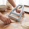 Rolling out dough with a stainless steel rolling pin