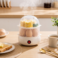 Electric egg cooker steaming eggs at breakfast