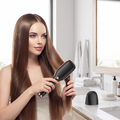 Woman straightening hair with a cordless ceramic straightener